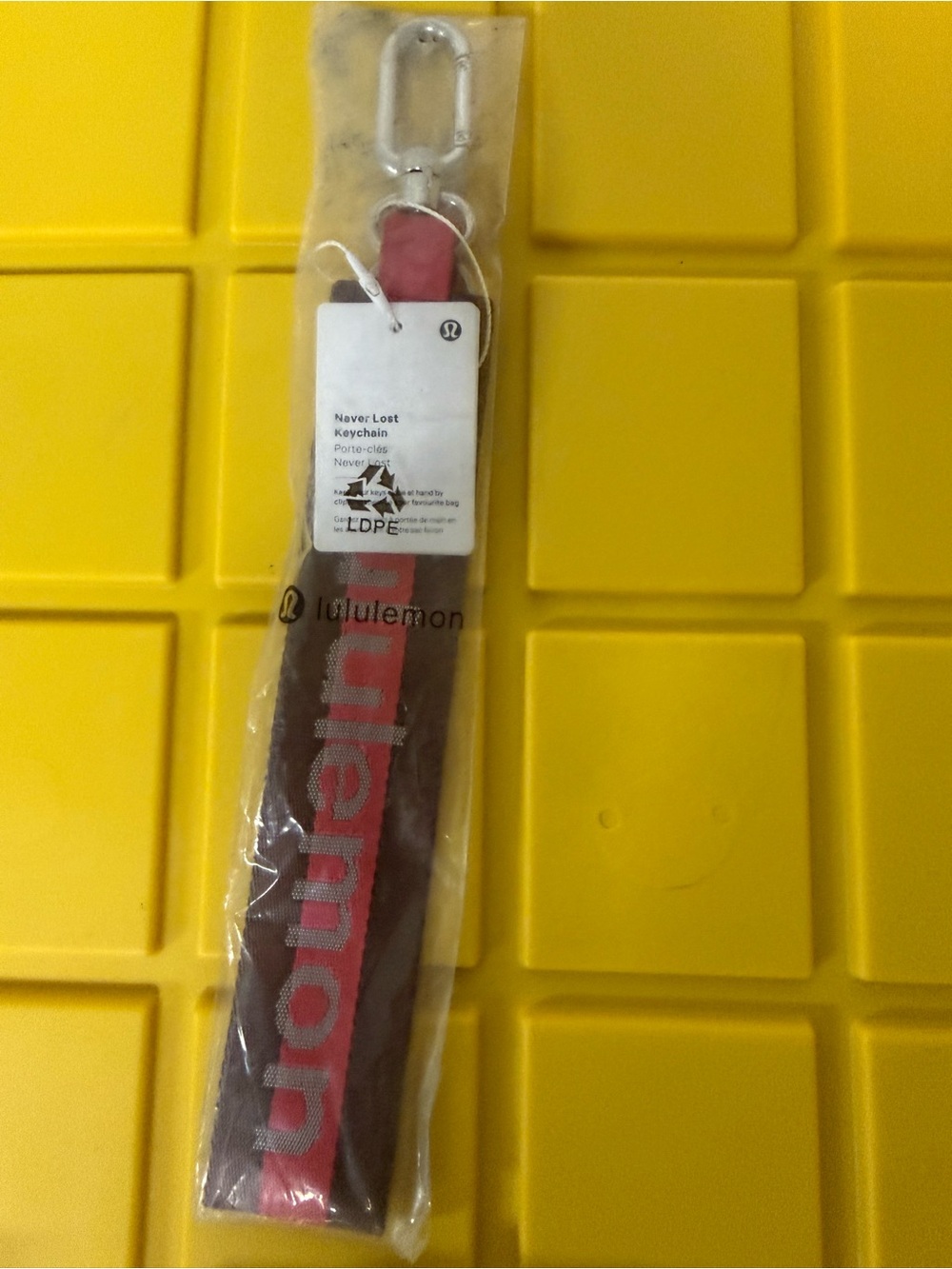 lululemon athletica red and black keychain strap with metal clip